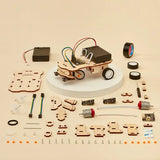 DIY car robotics kit with wooden components and electronic parts on a beige background