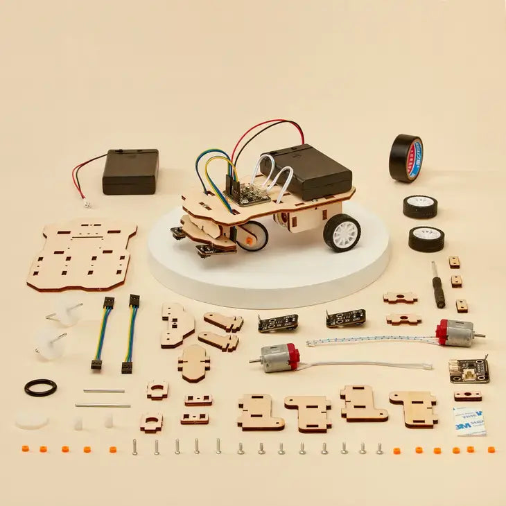 DIY car robotics kit with wooden components and electronic parts on a beige background
