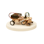 Small wooden DIY robot car with wheels on a white platform against a black background