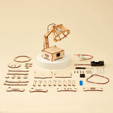 Wooden DIY lamp kit with components on a beige background