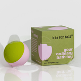 Pink and green montessori tactile bath ball with packaging labeled 'b is for ball' on a white background