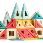 Colorful geometric magnetic wooden building blocks on a white background