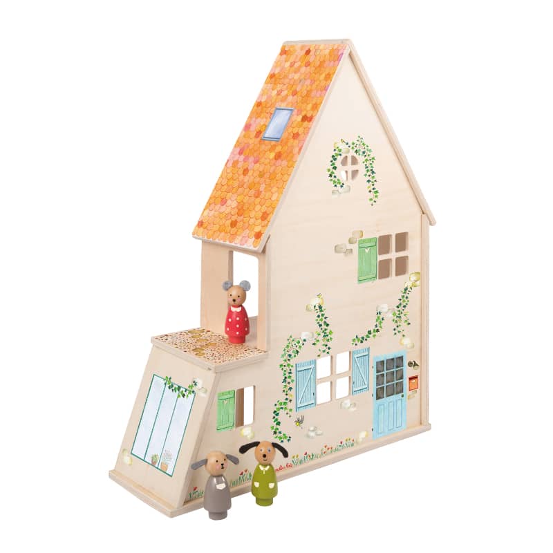 Wooden dollhouse with decorative elements and small figures on a white background