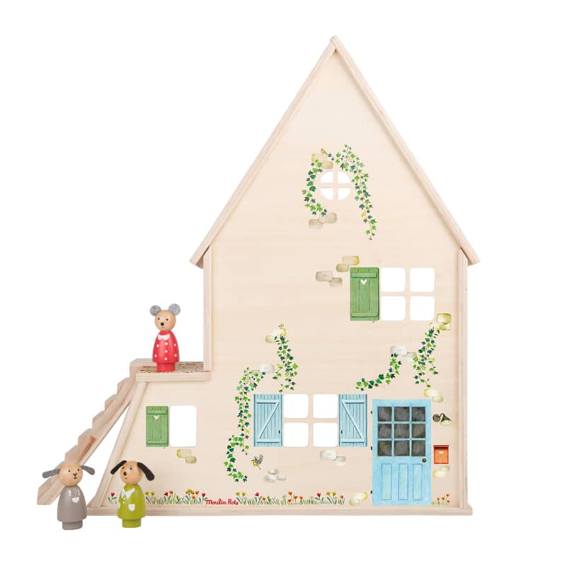 Small wooden house with decorative elements and toy figures on a white background