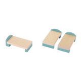 Three small wooden beds with blue frames and yellow mattress patterns on a white background