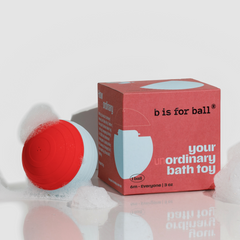 Red and blue bath ball with 'b is for ball' packaging on a white background
