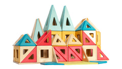 Colorful geometric magnetic wooden building blocks on a white background
